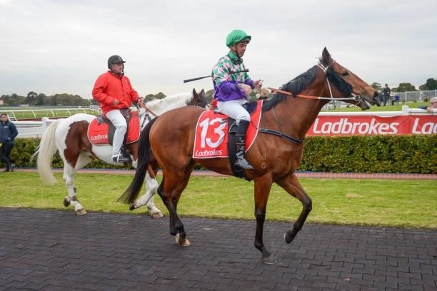 Dean Holland returns to the mounting yard on Sessions Road after winning the @2unitspodcast Handicap, at Ladbrokes Park Hillside Racecourse on July...