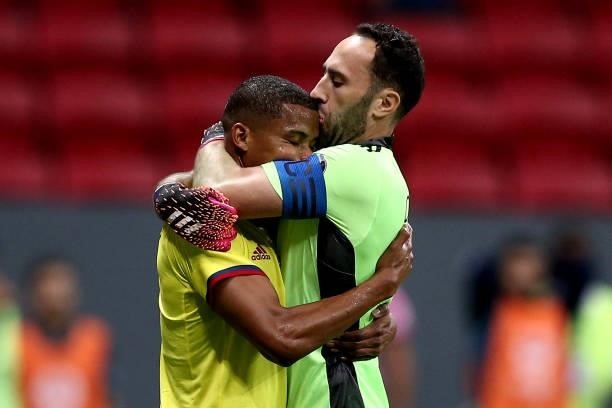 Goalkeeper David Ospina of Colombia reacts with Wilmar Barrios during a penalty shootout in the Conmebol Copa America Brazil 2021 semi-final between...