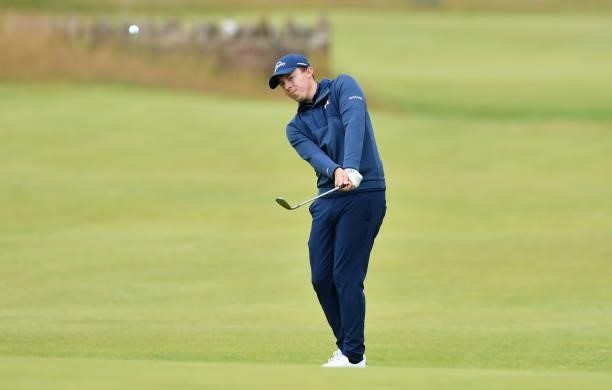 Matthew Fitzpatrick of England plays his third shot to the 18th hole during a practice day prior to the abrdn Scottish Open at The Renaissance Club...