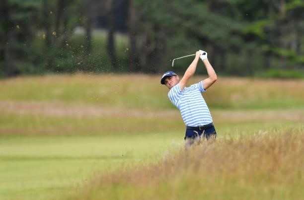 Justin Thomas of United States plays his second shot to the 18th hole during a practice day prior to the abrdn Scottish Open at The Renaissance Club...