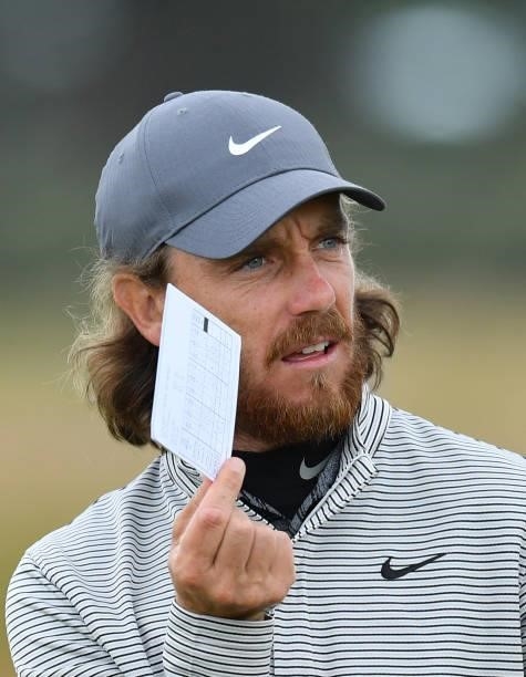 Tommy Fleetwood of England finishes his round at the 18th hole during a practice day prior to the abrdn Scottish Open at The Renaissance Club on July...