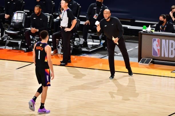 Head Coach Monty Williams of the Phoenix Suns talks with Devin Booker during Game One of the 2021 NBA Finals on July 6, 2021 at Phoenix Suns Arena in...