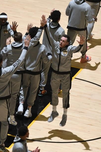 Pat Connaughton of the Milwaukee Bucks hi-fives teammates before the game against the Phoenix Suns during Game One of the 2021 NBA Finals on July 6,...