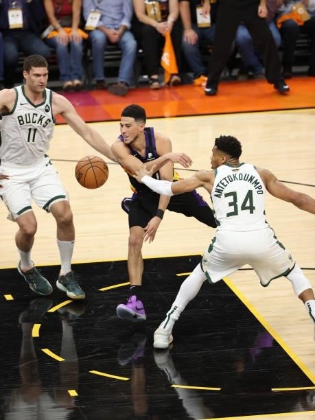 Devin Booker of the Phoenix Suns passes the ball during Game One of the 2021 NBA Finals on July 6, 2021 at Phoenix Suns Arena in Phoenix, Arizona....