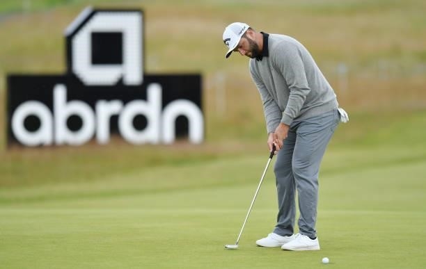 Jon Rahm of Spain putting at the 18th green during a practice day prior to the abrdn Scottish Open at The Renaissance Club on July 7, 2021 in North...