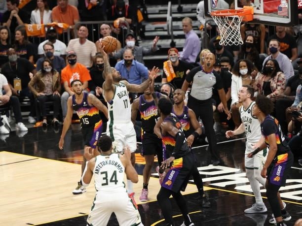 Tucker of the Milwaukee Bucks shoots the ball against the Phoenix Suns during Game One of the 2021 NBA Finals on July 6, 2021 at Phoenix Suns Arena...