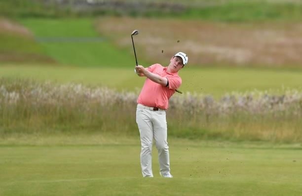 Robert McIntye of Scotland plays his second shot at the 18th hole during a practice day prior to the abrdn Scottish Open at The Renaissance Club on...