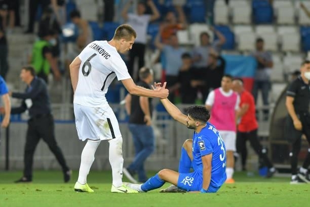 Vojislav Stankovic of Neftci and Zoran Marusic of Dinamo Tbilisi in action during the UEFA Champions League first qualifying round match between...