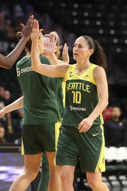 Sue Bird of the Seattle Storm high fives her teammate during the game against the Los Angeles Sparks on July 7, 2021 at the Angel of the Winds Arena,...