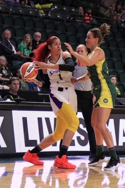 Amanda Zahui B of the Los Angeles Sparks looks to pass the ball against the Seattle Storm on July 7, 2021 at the Angel of the Winds Arena, in...