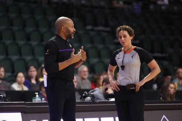 Head Coach, Derek Fisher of the Los Angeles Sparks talks with referee, Tiara Cruse during the game against the Los Angeles Sparks with on July 7,...