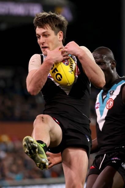 Zak Butters of the Power marks the ball during the 2021 AFL Round 17 match between the Port Adelaide Power and the Melbourne Demons at Adelaide Oval...