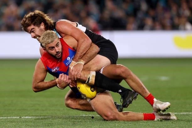 Scott Lycett of the Power tackles Christian Salem of the Demonsn during the 2021 AFL Round 17 match between the Port Adelaide Power and the Melbourne...