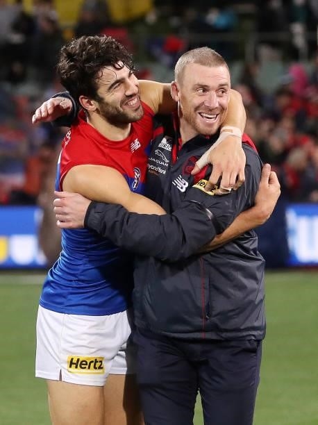 Christian Petracca of the Demons hugs coach Simon Goodwin after the win during the 2021 AFL Round 17 match between the Port Adelaide Power and the...