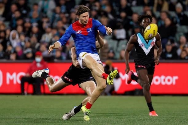 Ed Langdon of the Demons is tackled by Sam Powell-Pepper of the Power during the 2021 AFL Round 17 match between the Port Adelaide Power and the...