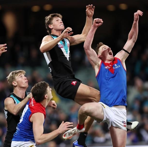 Mitch Georgiades of the Power looks to mark over Harrison Petty during the 2021 AFL Round 17 match between the Port Adelaide Power and the Melbourne...