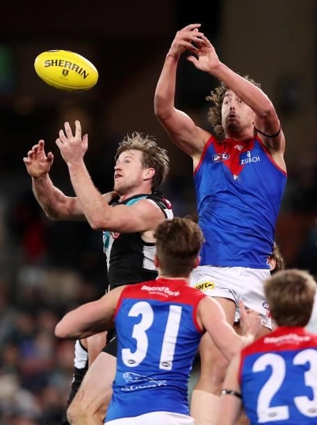 Tom Jonas of the Power and Luke Jackson of the Demons during the 2021 AFL Round 17 match between the Port Adelaide Power and the Melbourne Demons at...