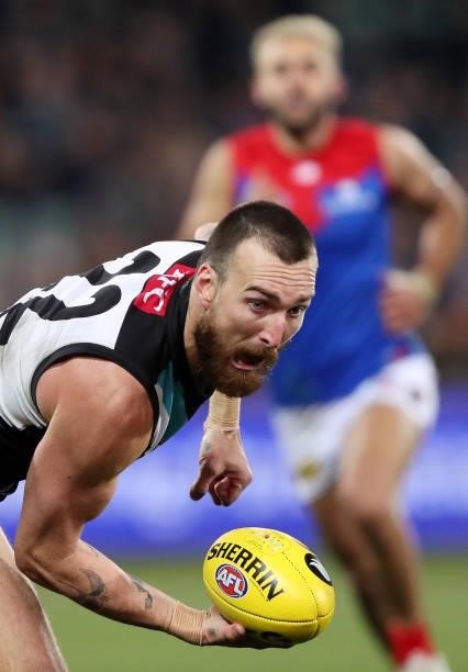 Charlie Dixon of the Power handpasses the ball during the 2021 AFL Round 17 match between the Port Adelaide Power and the Melbourne Demons at...