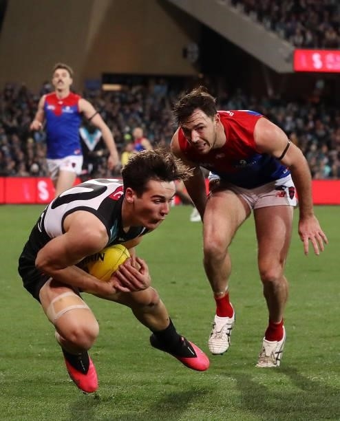 Connor Rozee of the Power marks the ball from Michael Hibberd of the Demons during the 2021 AFL Round 17 match between the Port Adelaide Power and...