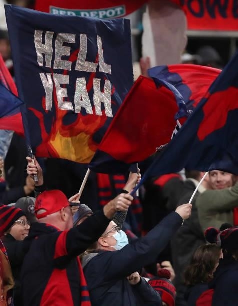 Melbourne fans celebrate another goal during the 2021 AFL Round 17 match between the Port Adelaide Power and the Melbourne Demons at Adelaide Oval on...