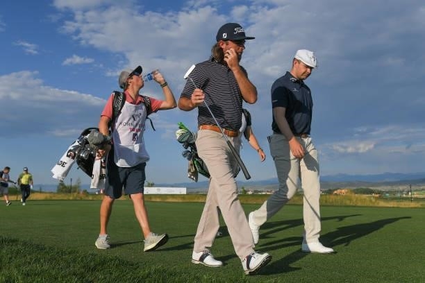 Joey Garber and Harry Hall of England walk with their caddies along the second tee box during the first round of the Korn Ferry Tours TPC Colorado...