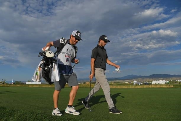 Brett Coletta of Australia and his caddie walk along the second tee box during the first round of the Korn Ferry Tours TPC Colorado Championship at...
