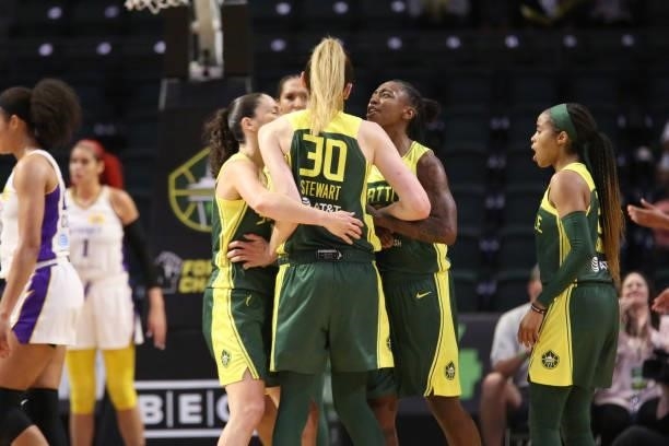 Sue Bird, Breanna Stewart and Jewell Loyd of the Seattle Storm celebrate during the game against the Los Angeles Sparks on July 7, 2021 at the Angel...