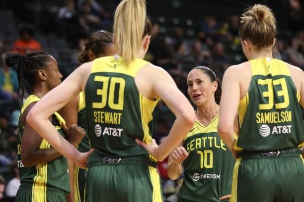 Sue Bird talks with Breanna Stewart and Katie Lou Samuelson of the Seattle Storm during the game against the Los Angeles Sparks on July 7, 2021 at...