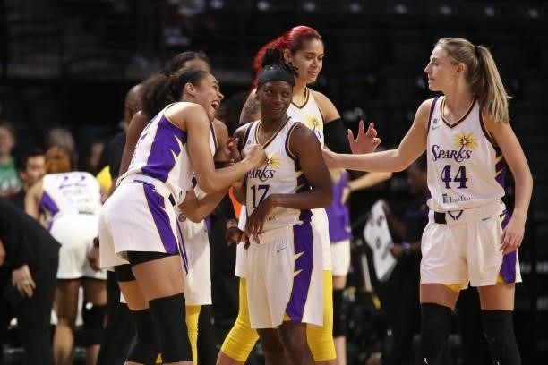 Nia Coffey celebrates with Erica Wheeler of the Los Angeles Sparks during the game against the Seattle Storm on July 7, 2021 at the Angel of the...