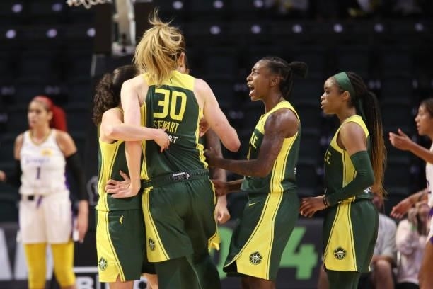 Sue Bird, Breanna Stewart and Jewell Loyd of the Seattle Storm celebrate during the game against the Los Angeles Sparks on July 7, 2021 at the Angel...