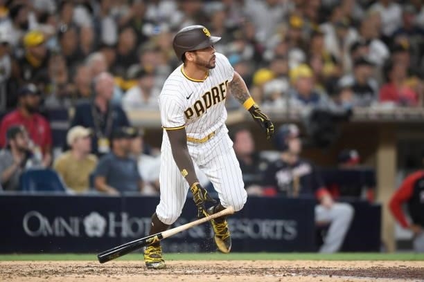 Tommy Pham of the San Diego Padres hits an RBI double during the sixth inning of a baseball game against Washington Nationals at PETCO Park on July...