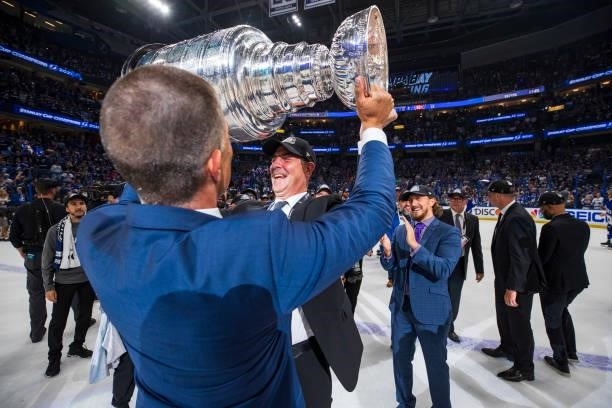 Jamie Pushor, Director Of Professional Scouting of the Tampa Bay Lightning hoists the Stanley Cup overhead after the Tampa Bay Lightning defeated the...