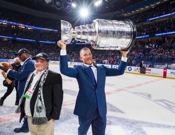 Julien BriseBois, Vice President & General Manager, Alternate Governor of the Tampa Bay Lightning hoists the Stanley Cup overhead after the Tampa Bay...
