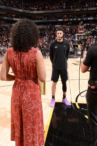 Devin Booker of the Phoenix Suns talks to ESPN Sideline Reporter, Malika Andrews, after the game against the Milwaukee Bucks during Game Two of the...