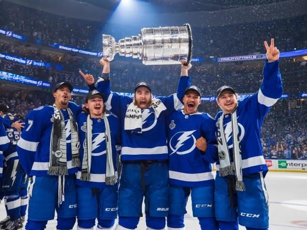 Mathieu Joseph, Alex Barre-Boulet, David Savard, Daniel Walcott, and Yanni Gourde of the Tampa Bay Lightning celebrates with the Stanley Cup after...