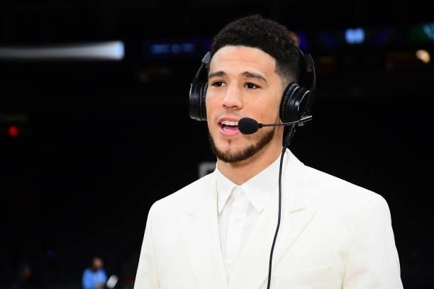 Devin Booker of the Phoenix Suns talks with the media after the game against the Milwaukee Bucks during Game Two of the 2021 NBA Finals on July 8,...