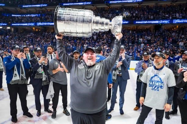 Rob Kennedy, Assistant Equipment Manager of the Tampa Bay Lightning hoists the Stanley Cup overhead after the Tampa Bay Lightning defeated the...