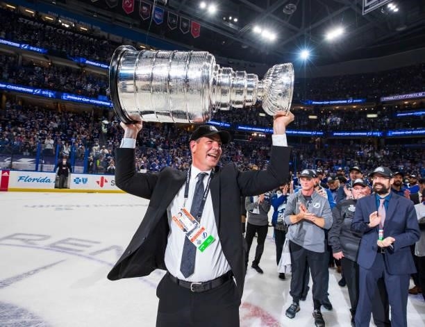 Jamie Pushor, Director Of Professional Scouting of the Tampa Bay Lightning hoists the Stanley Cup overhead after the Tampa Bay Lightning defeated the...