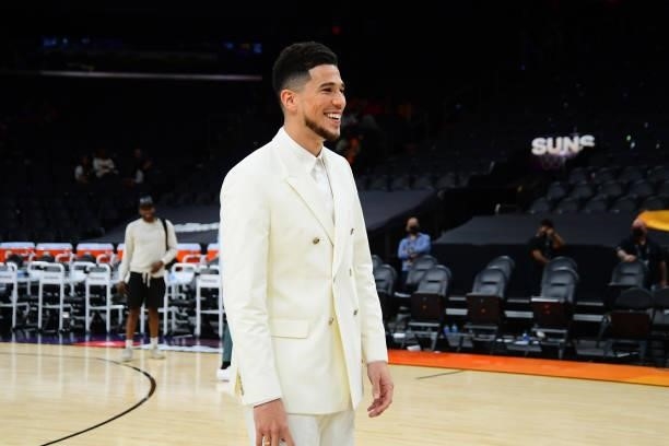 Devin Booker of the Phoenix Suns smiles after the game against the Milwaukee Bucks during Game Two of the 2021 NBA Finals on July 8, 2021 at Phoenix...
