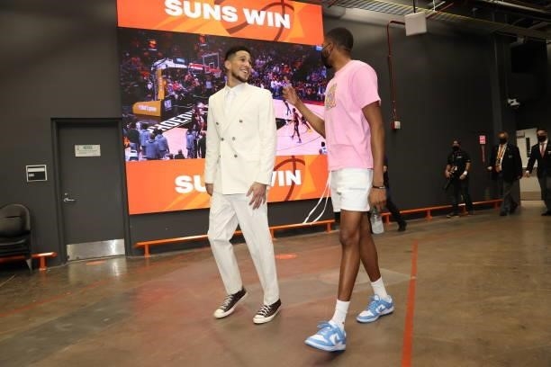 Devin Booker and Mikal Bridges of the Phoenix Suns leave the arena after the game against the Milwaukee Bucks during Game Two of the 2021 NBA Finals...