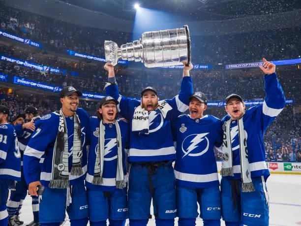 Mathieu Joseph, Alex Barre-Boulet, David Savard, Daniel Walcott, and Yanni Gourde of the Tampa Bay Lightning celebrates with the Stanley Cup after...