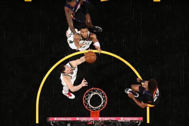 Giannis Antetokounmpo of the Milwaukee Bucks rebounds the ball against the Phoenix Suns during Game Two of the 2021 NBA Finals on July 8, 2021 at...
