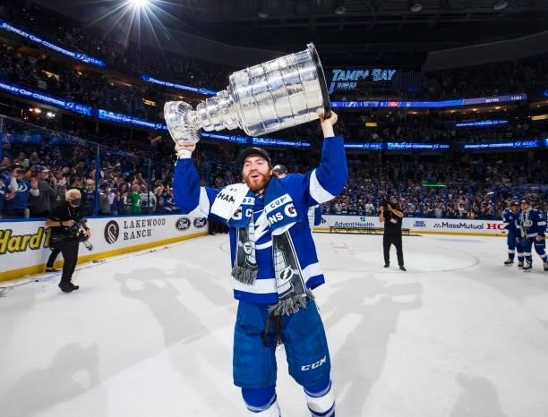 Brayden Point of the Tampa Bay Lightning hoists the Stanley Cup overhead after the Tampa Bay Lightning defeated the Montreal Canadiens in Game Five...