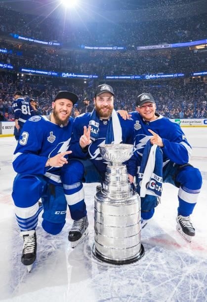Fredrik Claesson, Victor Hedman, and Andreas Borgman of the Tampa Bay Lightning celebrates with the Stanley Cup after defeating the Montreal...