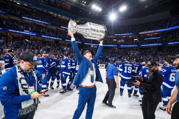 Director of Player Development J.P. Cote of the Tampa Bay Lightning hoists the Stanley Cup overhead after the Tampa Bay Lightning defeated the...