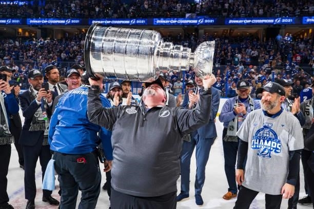 Rob Kennedy, Assistant Equipment Manager of the Tampa Bay Lightning hoists the Stanley Cup overhead after the Tampa Bay Lightning defeated the...