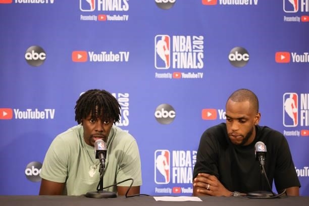 Jrue Holiday of the Milwaukee Bucks and Khris Middleton of the Milwaukee Bucks talk with the media after the game against the Phoenix Suns during...
