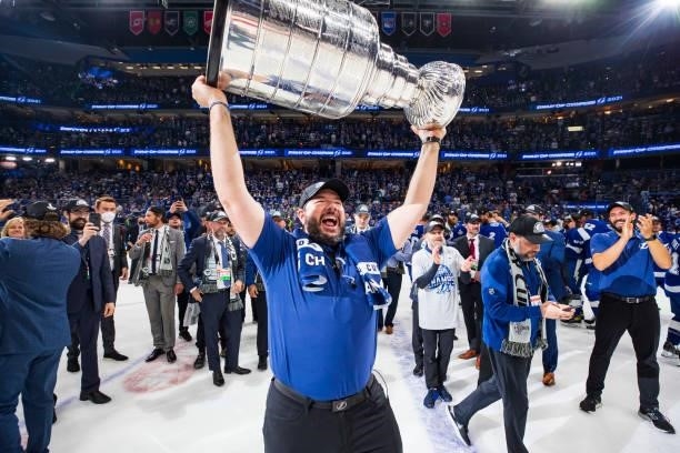 Tom Mulligan, Head Athletic Trainer for the Tampa Bay Lightning hoists the Stanley Cup overhead after the Tampa Bay Lightning defeated the Montreal...