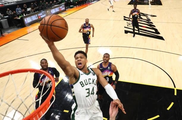 Milwaukee Bucks forward Giannis Antetokounmpo moves in for a basket ahead of Phoenix Suns forward Jae Crowder and guard Chris Paul in Game Two of the...