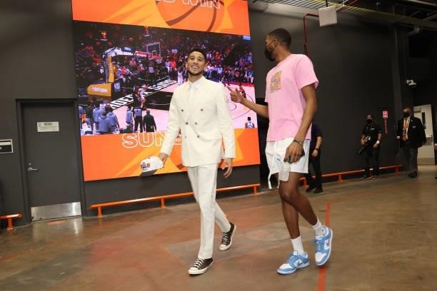 Devin Booker and Mikal Bridges of the Phoenix Suns leave the arena after the game against the Milwaukee Bucks during Game Two of the 2021 NBA Finals...